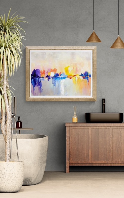 An abstract cityscape in soft shades of blue, violet, yellow, orange and pink. Expressive blocks of colour evoke urban buildings and their reflections in water beneath a bright, delicate sky. Original artwork by Annmarie Saša Prah.